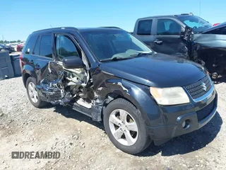 2009 Suzuki Grand Vitara z VIN JS3TE047094100192, wystawiony jako IAAI lot #42336959 z przebiegiem 244 995 mil mil oraz . Historia ofert i sprzedaży dostępna na DreamBid. Obrazek 1.