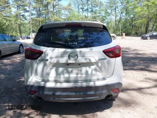 2016 Mazda CX-5 Grand Touring with VIN JM3KE2DY0G0870077, listed as a IAAI auction lot 42158225 with 93,816 mi miles. Bid and sale history available at carsss.com. Image 16.
