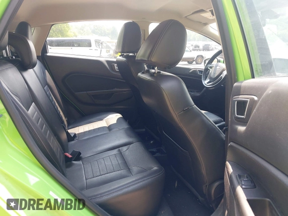 2014 Ford Fiesta Titanium z VIN 3FADP4FJ7EM203322, wystawiony jako IAAI lot #42448840 z przebiegiem 91 901 mil mil oraz . Historia ofert i sprzedaży dostępna na DreamBid. Obrazek 8.