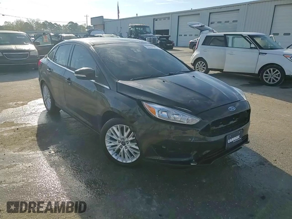 2016 Ford Focus Titanium with VIN 1FADP3J22GL201721, listed as a Copart auction lot 50633795 with 29,801 mi miles and Salvage title. Bid and sale history available at DreamBid. Image 14.