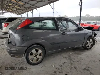 2003 Ford Focus ZX3 with VIN 3FAFP31Z73R178518, listed as a Copart auction lot 50200105 with 317,147 mi miles and Salvage title. Bid and sale history available at DreamBid. Image 3.