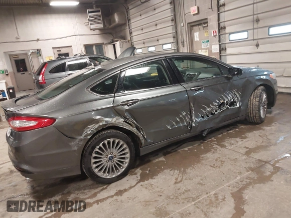 2013 Ford Fusion Titanium Hybrid with VIN 3FA6P0RU6DR319586, listed as a IAAI auction lot 42138979 with 125,388 mi miles. Bid and sale history available at carsss.com. Image 4.
