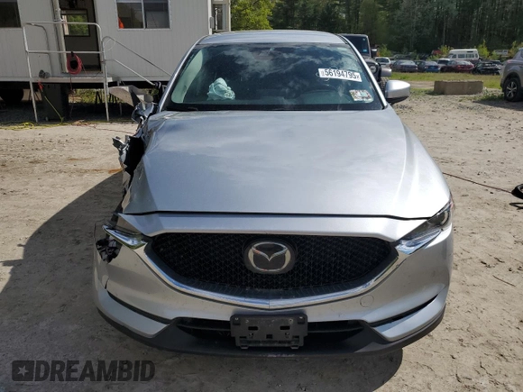 2021 Mazda CX-5 Touring z VIN JM3KFBCM1M0343804, wystawiony jako Copart lot #56194795 z przebiegiem 100 039 mil mil oraz Tytuł czysty. Historia ofert i sprzedaży dostępna na DreamBid. Obrazek 5.