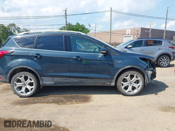 2019 Ford Escape Titanium with VIN 1FMCU9J99KUC00935, listed as a IAAI auction lot 42583250 with 91,241 mi miles and . Bid and sale history available at DreamBid. Image 14.