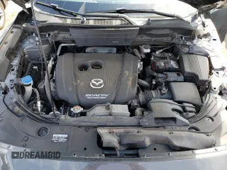 2018 Mazda CX-5 Grand Touring z VIN JM3KFBDM4J0300519, wystawiony jako Copart lot #51548745 z przebiegiem 102 853 mil mil oraz Szkoda całkowita • Salvage title. Historia ofert i sprzedaży dostępna na DreamBid. Obrazek 12.