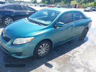 2009 Toyota Corolla with VIN JTDBL40EX99034801, listed as a IAAI auction lot 41943591 with 204,674 mi miles. Bid and sale history available at carsss.com. Image 2.