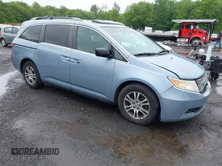 2011 Honda Odyssey EX-L with VIN 5FNRL5H60BB020452, listed as a IAAI auction lot 42334129 with 290,630 mi miles and . Bid and sale history available at DreamBid. Image 1.
