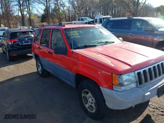 1997 Jeep Grand Cherokee Laredo with VIN 1J4GZ58S0VC550242, listed as a IAAI auction lot 41032114 with 185,307 mi miles. Bid and sale history available at carsss.com. Image 13.