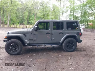 2021 Jeep Wrangler Unlimited Sahara with VIN 1C4HJXEG0MW703812, listed as a IAAI auction lot 42186089 with 50,349 mi miles and . Bid and sale history available at DreamBid. Image 15.