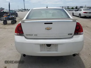 2012 Chevrolet Impala LTZ with VIN 2G1WC5E33C1131846, listed as a Copart auction lot 54431515 with 228,537 mi miles and Salvage Title. Bid and sale history available at DreamBid. Image 6.