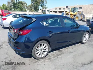 2017 Mazda 3 Touring with VIN 3MZBN1L77HM140562, listed as a IAAI auction lot 42761296 with 76,987 mi miles and . Bid and sale history available at DreamBid. Image 4.