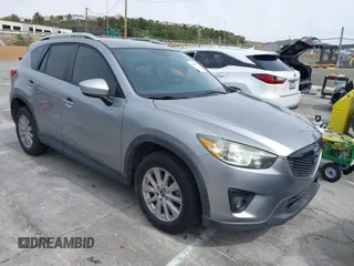 2014 Mazda CX-5 Touring with VIN JM3KE2CY3E0429025, listed as a IAAI auction lot 41680713 with 113,065 mi miles. Bid and sale history available at carsss.com. Image 1.