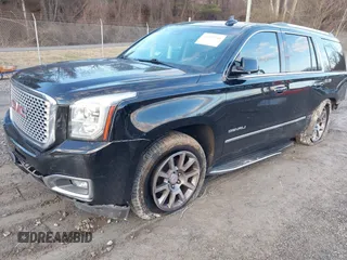 2016 GMC Yukon Denali with VIN 1GKS2CKJ2GR412201, listed as a IAAI auction lot 41185716 with 124,421 mi miles. Bid and sale history available at carsss.com. Image 22.