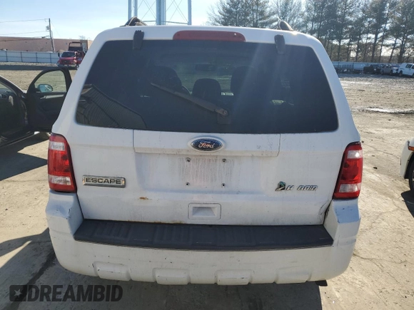 2010 Ford Escape Hybrid z VIN 1FMCU5K36AKD07129, wystawiony jako Copart lot #43914265 z przebiegiem 198 624 mil mil oraz Czysty tytuł • Clean title. Historia ofert i sprzedaży dostępna na DreamBid. Obrazek 6.