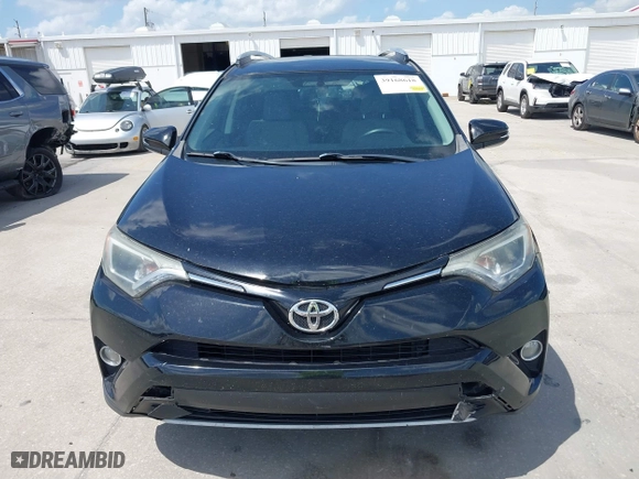 2016 Toyota RAV4 XLE with VIN 2T3WFREV4GW294428, listed as a IAAI auction lot 39168618 with 115,791 mi miles. Bid and sale history available at carsss.com. Image 12.