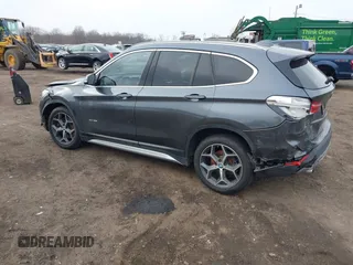 2017 BMW X1 xDrive28i with VIN WBXHT3C35H5F74213, listed as a IAAI auction lot 41589180 with 58,990 mi miles. Bid and sale history available at carsss.com. Image 3.