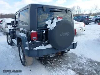 2014 Jeep Wrangler Sport with VIN 1C4AJWAG5EL285994, listed as a IAAI auction lot 41558673 with 98,779 mi miles. Bid and sale history available at carsss.com. Image 3.