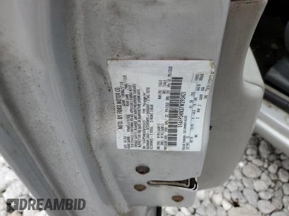 2007 Ford Focus S z VIN 1FAFP34N37W293421, wystawiony jako Copart lot #57833445 z przebiegiem 159 523 mil mil oraz Szkoda całkowita • Salvage title. Historia ofert i sprzedaży dostępna na DreamBid. Obrazek 13.