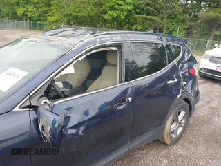 2017 Hyundai Santa Fe 2.4L z VIN 5XYZUDLB9HG421284, wystawiony jako IAAI lot #42441436 z przebiegiem 96 155 mil mil oraz . Historia ofert i sprzedaży dostępna na DreamBid. Obrazek 6.