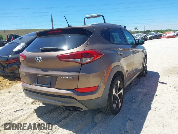 2016 Hyundai Tucson Sport with VIN KM8J33A29GU054909, listed as a IAAI auction lot 41835688 with 90,751 mi miles. Bid and sale history available at carsss.com. Image 4.
