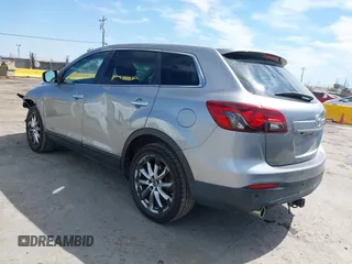 2014 Mazda CX-9 Grand Touring z VIN JM3TB2DVXE0432991, wystawiony jako IAAI lot #42826784 z przebiegiem 134 265 mil mil oraz . Historia ofert i sprzedaży dostępna na DreamBid. Obrazek 3.
