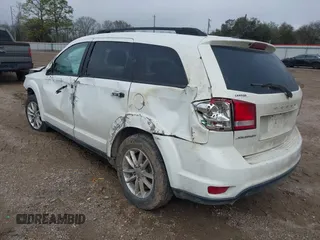 2015 Dodge Journey SXT with VIN 3C4PDCBG5FT744056, listed as a IAAI auction lot 41650391 with 148,192 mi miles and . Bid and sale history available at DreamBid. Image 3.