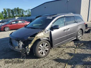 2014 Honda Odyssey Touring z VIN 5FNRL5H90EB007862, wystawiony jako Copart lot #60470005 z przebiegiem 135 686 mil mil oraz Czysty tytuł • Clean title. Historia ofert i sprzedaży dostępna na DreamBid. Obrazek 1.