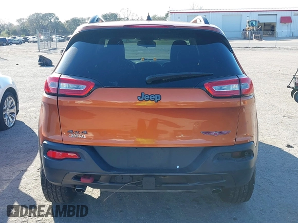 2014 Jeep Cherokee Trailhawk with VIN 1C4PJMBS4EW254879, listed as a IAAI auction lot 41550356 with 101,077 mi miles. Bid and sale history available at carsss.com. Image 17.
