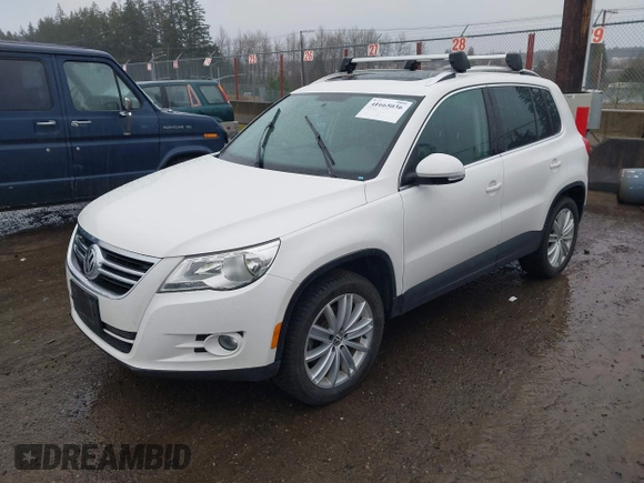 2011 Volkswagen Tiguan SE with VIN WVGBV7AXXBW546640, listed as a IAAI auction lot 41665036 with 106,071 mi miles and . Bid and sale history available at DreamBid. Image 2.
