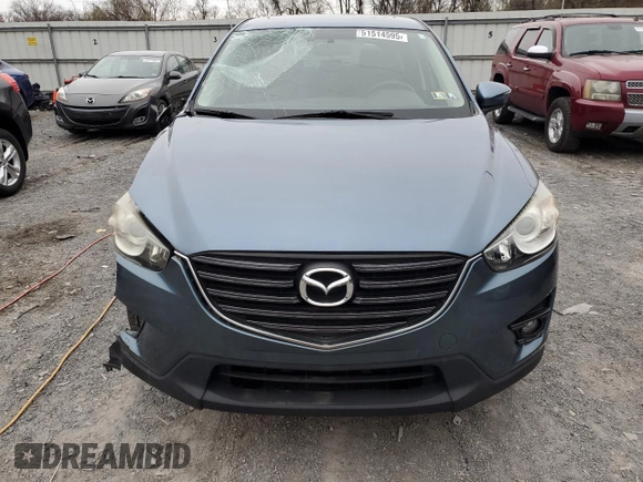 2016 Mazda CX-5 Grand Touring with VIN JM3KE4DY7G0761594, listed as a Copart auction lot 51514595 with 58,250 mi miles and Salvage Title. Bid and sale history available at DreamBid. Image 5.