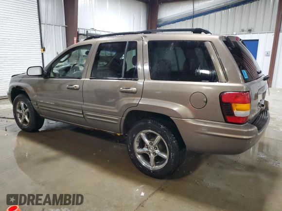 2002 Jeep Grand Cherokee Limited with VIN 1J4GW58NX2C248892, listed as a Copart auction lot 55574615 with 164,010 mi miles and Salvage title. Bid and sale history available at DreamBid. Image 2.