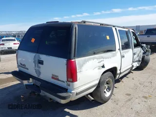 1996 GMC Suburban with VIN 1GDEC16R8TJ738647, listed as a IAAI auction lot 41688543 with 216,078 mi miles. Bid and sale history available at carsss.com. Image 4.