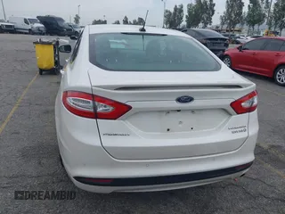 2013 Ford Fusion Titanium Hybrid with VIN 3FA6P0RUXDR386675, listed as a IAAI auction lot 42013986 with 89,349 mi miles. Bid and sale history available at carsss.com. Image 17.