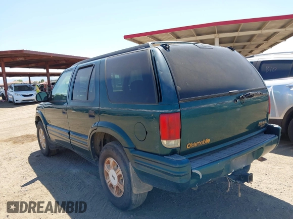 1996 Oldsmobile Bravada z VIN 1GHDT13W5T2711291, wystawiony jako IAAI lot #42502672 z przebiegiem 219 062 mil mil oraz . Historia ofert i sprzedaży dostępna na DreamBid. Obrazek 14.