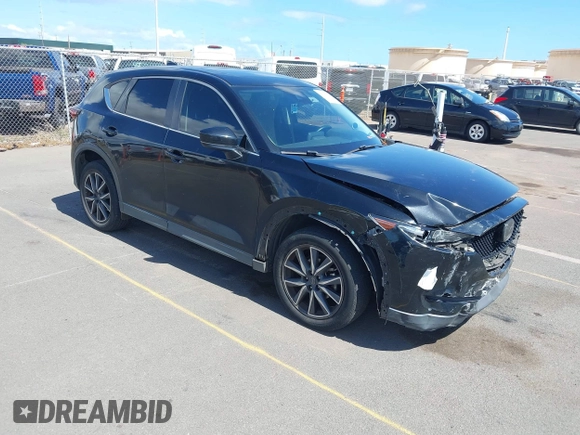 2018 Mazda CX-5 Touring z VIN JM3KFACM5J0309533, wystawiony jako IAAI lot #42195429 z przebiegiem 91 928 mil mil oraz . Historia ofert i sprzedaży dostępna na DreamBid. Obrazek 1.