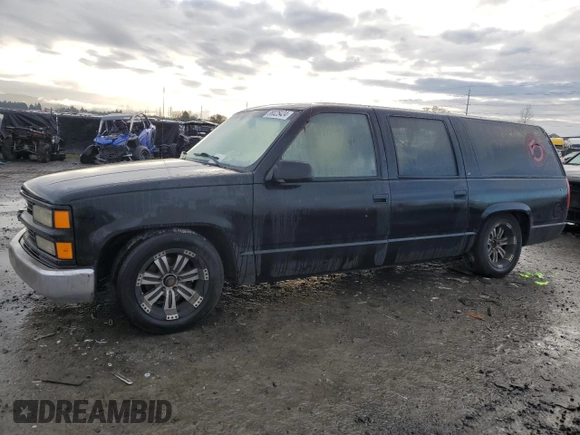 1996 Chevrolet Suburban with VIN 3GNEC16R9TG167845, listed as a Copart auction lot 80119734 with 414,794 mi miles and Salvage title. Bid and sale history available at DreamBid. Image 1.
