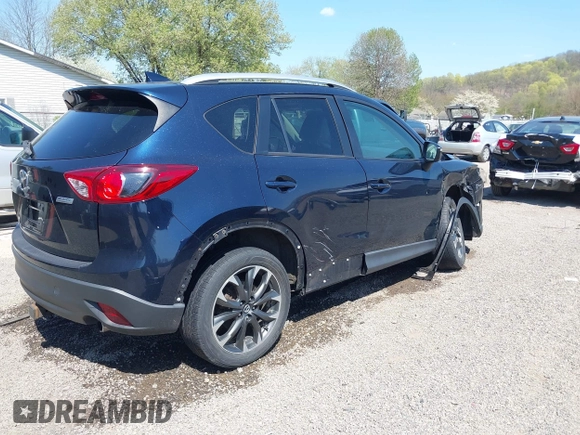 2016 Mazda CX-5 Grand Touring with VIN JM3KE4DY5G0681369, listed as a IAAI auction lot 42102805 with 128,182 mi miles and . Bid and sale history available at DreamBid. Image 4.
