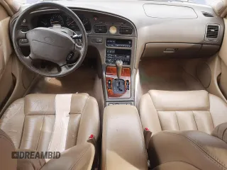 1994 Infiniti Q45 z VIN JNKNG01D1RM256994, wystawiony jako Copart lot #49919695 z przebiegiem 224 673 mil mil oraz Szkody całkowita. Historia ofert i sprzedaży dostępna na DreamBid. Obrazek 8.