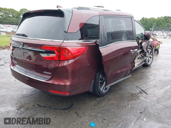 2021 Honda Odyssey Touring with VIN 5FNRL6H88MB006938, listed as a IAAI auction lot 42367022 with 63,280 mi miles and . Bid and sale history available at DreamBid. Image 4.