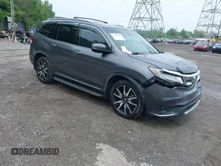 2019 Honda Pilot Touring 8-Passenger with VIN 5FNYF6H97KB013002, listed as a IAAI auction lot 42265143 with 120,322 mi miles and . Bid and sale history available at DreamBid. Image 1.