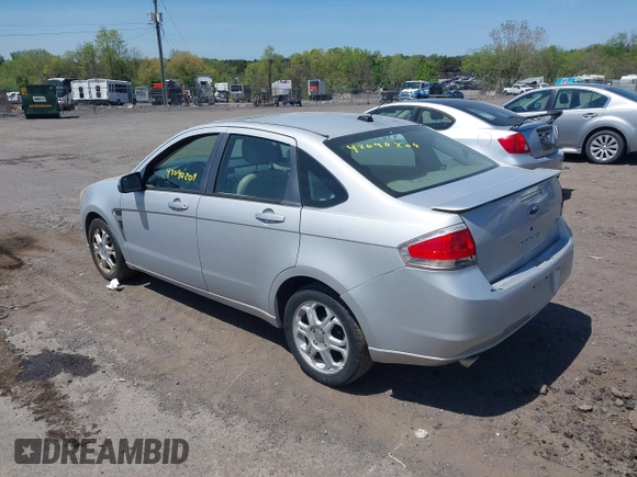 2008 Ford Focus SE with VIN 1FAHP35N88W271973, listed as a IAAI auction lot 42090204 with 261,457 mi miles. Bid and sale history available at carsss.com. Image 3.