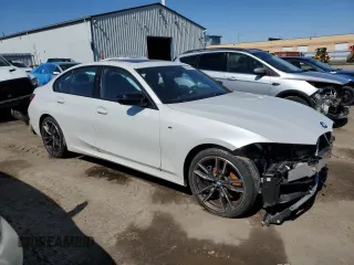 2022 BMW 3 Series M340i xDrive with VIN WBA5U9C02NFM31354, listed as a Copart auction lot 50986335 with Not Provided miles and Clean Title. Bid and sale history available at DreamBid. Image 4.