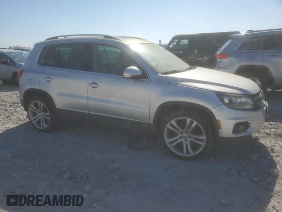 2012 Volkswagen Tiguan S with VIN WVGBV7AX5CW601352, listed as a Copart auction lot 48768155 with 161,632 mi miles and Salvage Title. Bid and sale history available at DreamBid. Image 4.