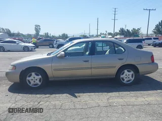 2000 Nissan Altima XE with VIN 1N4DL01D3YC197921, listed as a IAAI auction lot 41953585 with 84,233 mi miles. Bid and sale history available at carsss.com. Image 14.