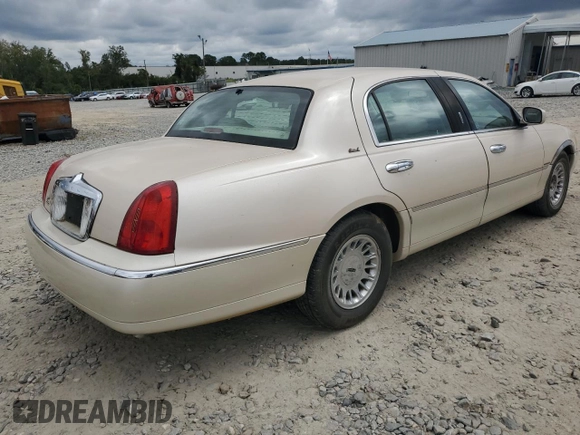2001 Lincoln Town Car Cartier L z VIN 1LNHM85W61Y640344, wystawiony jako Copart lot #74755564 z przebiegiem Nie podano mil oraz Szkoda całkowita • Salvage title. Historia ofert i sprzedaży dostępna na DreamBid. Obrazek 3.
