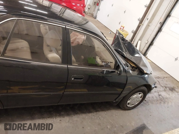 1994 Toyota Camry LE with VIN JT2SK12E3R0207215, listed as a IAAI auction lot 41788670 with 124,010 mi miles. Bid and sale history available at carsss.com. Image 14.
