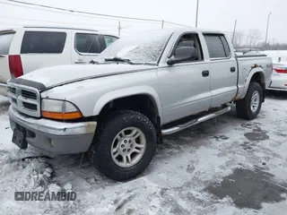 2004 Dodge Dakota SLT with VIN 1D7HG48N34S665027, listed as a IAAI auction lot 41395509 with 128,064 mi miles. Bid and sale history available at carsss.com. Image 2.