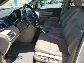 2015 Honda Odyssey Touring Elite z VIN 5FNRL5H91FB053430, wystawiony jako Copart lot #55276315 z przebiegiem 96 667 mil mil oraz Szkoda całkowita • Salvage title. Historia ofert i sprzedaży dostępna na DreamBid. Obrazek 7.