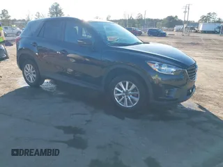 2016 Mazda CX-5 Touring z VIN JM3KE2CY3G0844624, wystawiony jako IAAI lot #41629301 z przebiegiem 108 209 mil mil oraz . Historia ofert i sprzedaży dostępna na DreamBid. Obrazek 1.