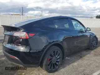 2022 Tesla Model Y Performance with VIN 7SAYGDEF9NF455508, listed as a Copart auction lot 51517205 with Not provided miles and Salvage title. Bid and sale history available at DreamBid. Image 3.